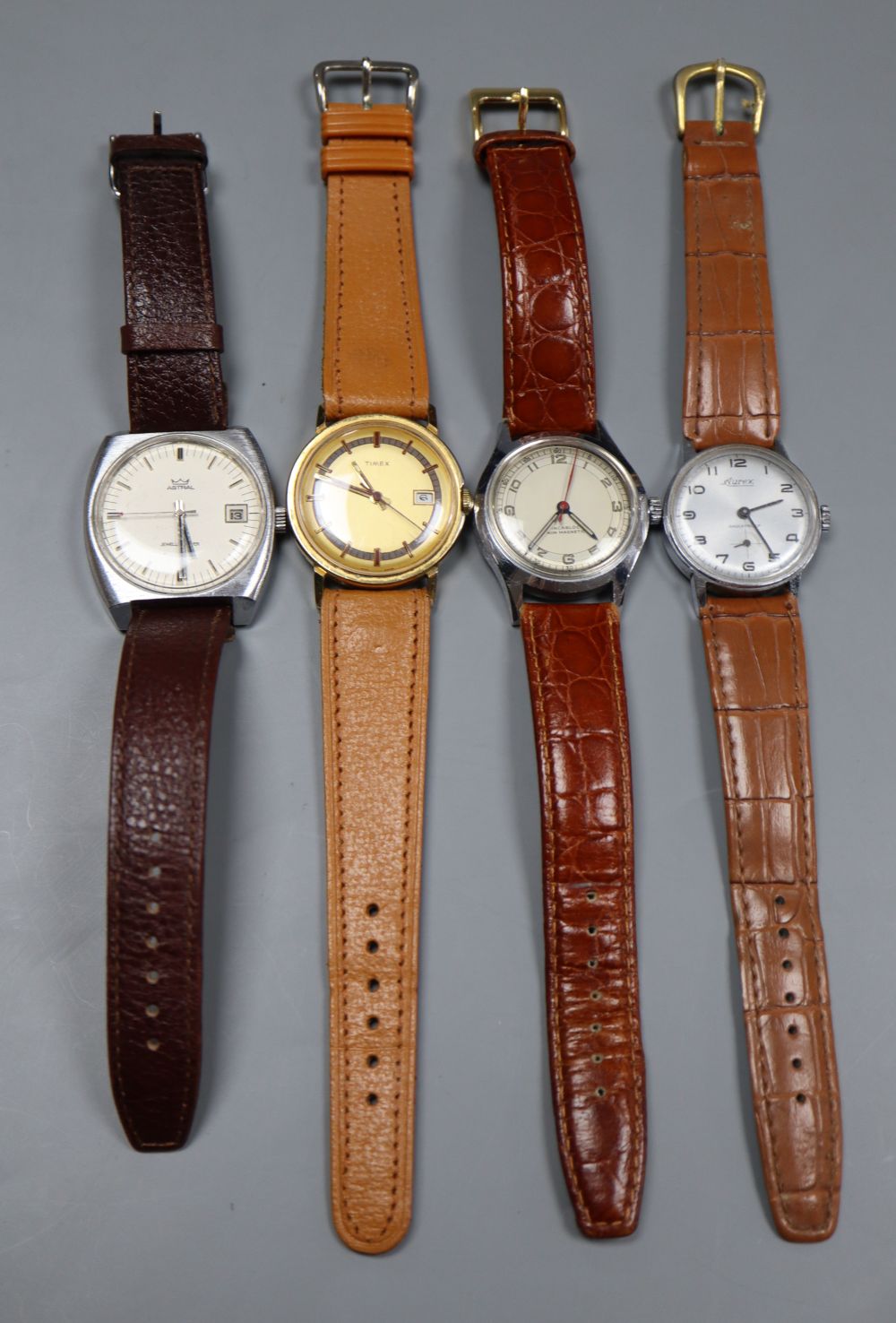 Four assorted wrist watches including Astral, Aurex & Timex.